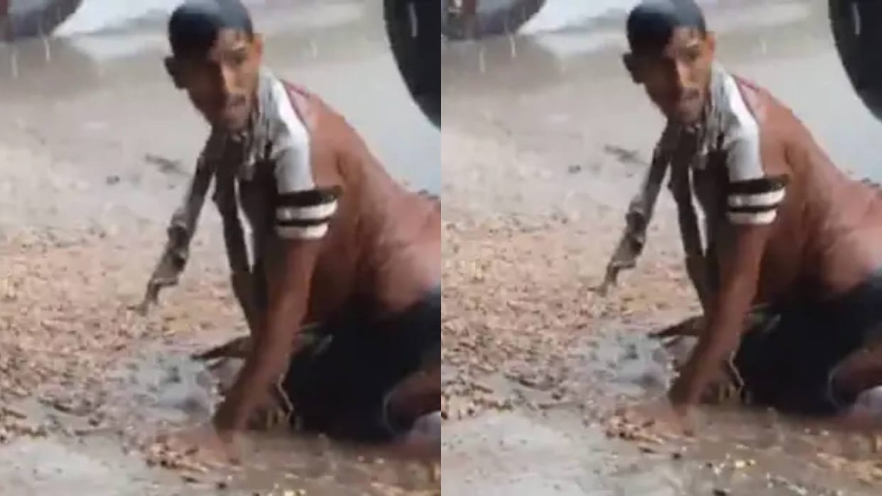 A helpless farmer seen saving his crop in the rain everything destroyed in front of his eyes Video goes viral