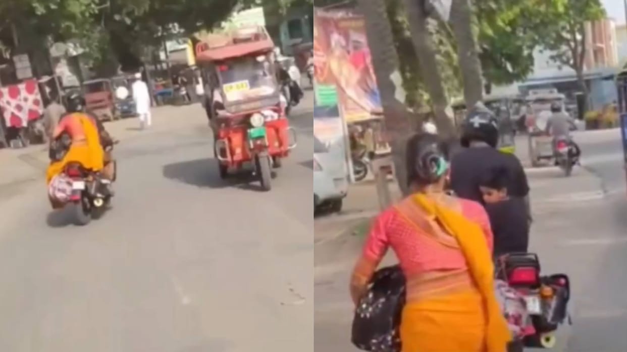 Wife sitting behind on bike fell down man had no clue Video goes viral on Internet see netizens reaction