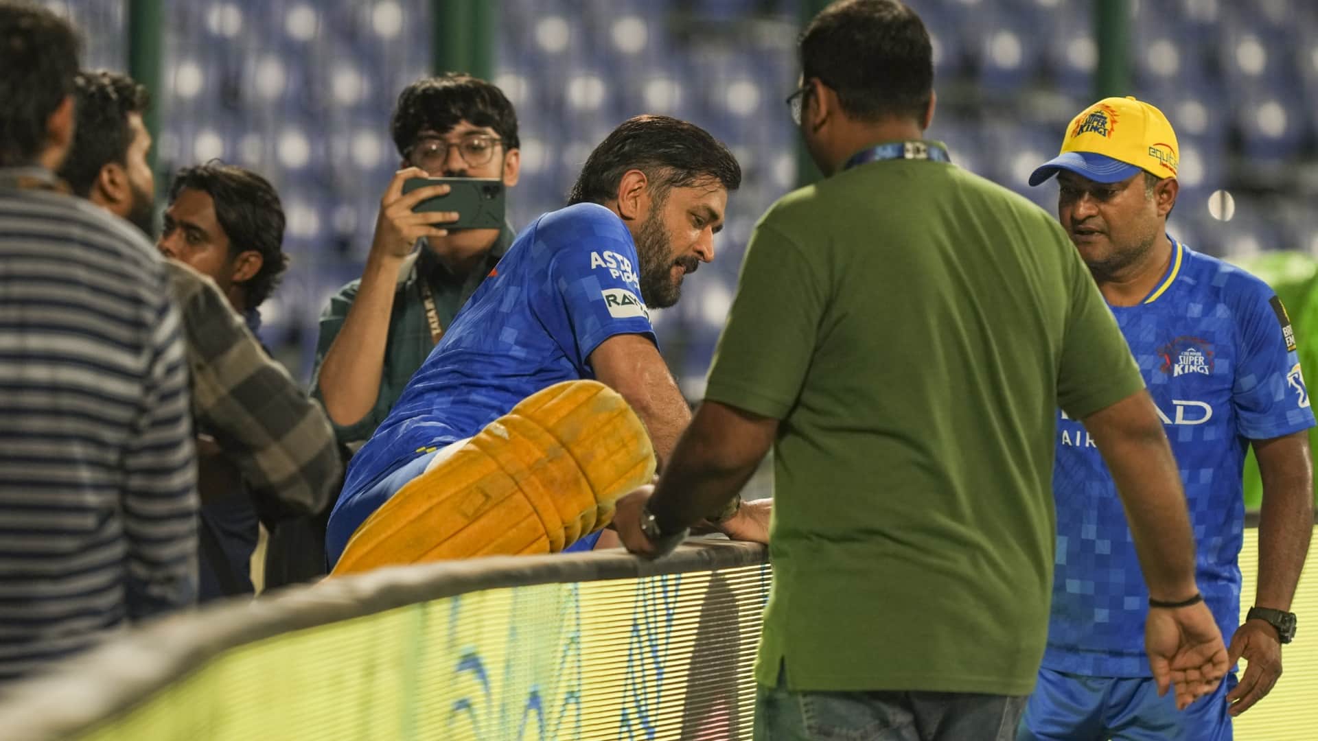 CSK captain MS Dhoni had a heartwarming meet-up with a young fan as he jumped over fence to meet him IPL 2025