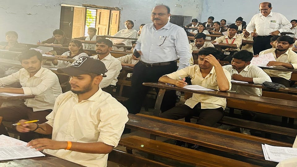 Three students were caught cheating in B.Ed exam writing answers by looking at their mobiles
