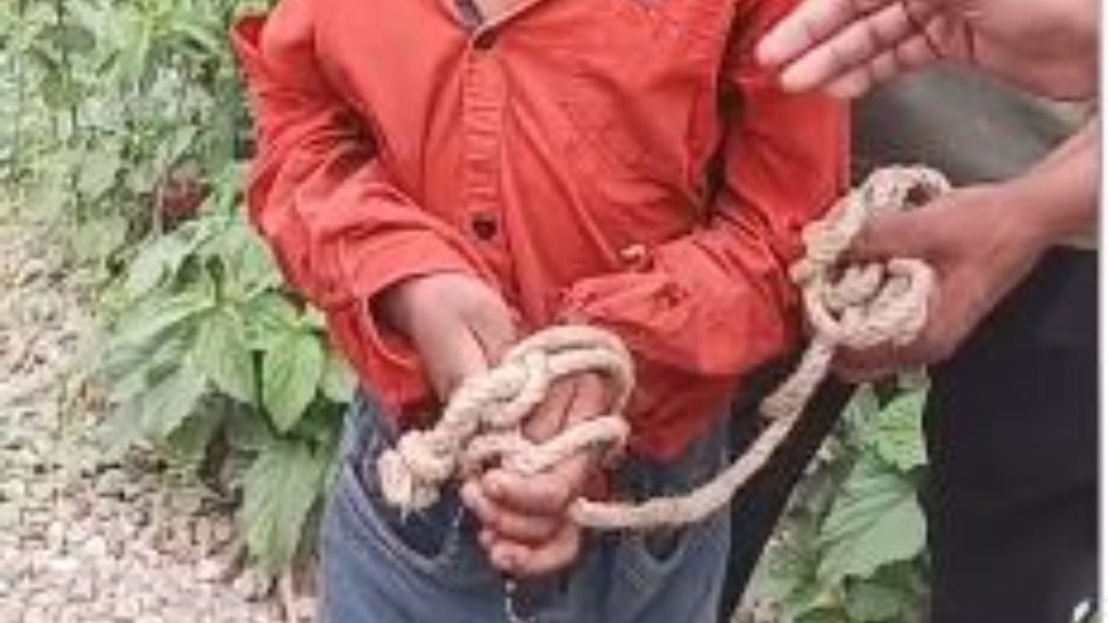 Grandfather tied his grandson hands and feet with rope and taking him to school on handcart in Amritsar