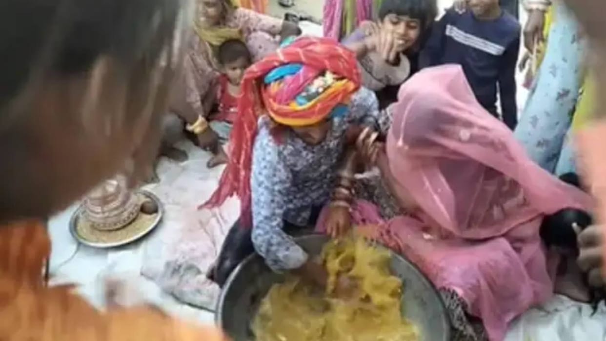 Bride and Grooms Hilarious Tug of War During Ring Finding Ritual Video Goes Viral