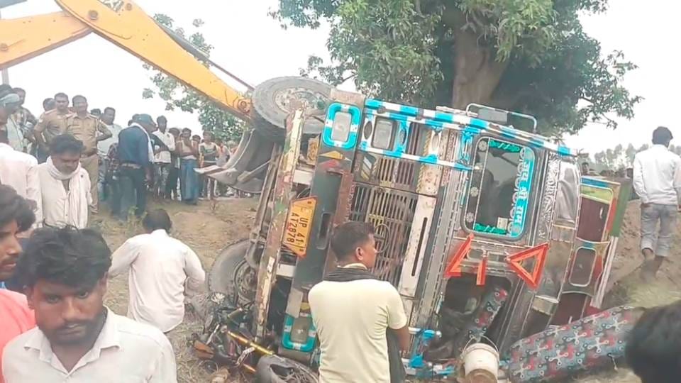 truck loaded with sand overturned in Shravasti woman died and two injured after being crushed under it
