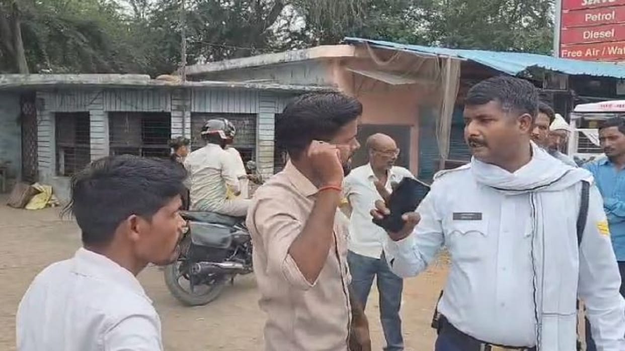 When the traffic policeman stopped them the bike riders showed their arrogance