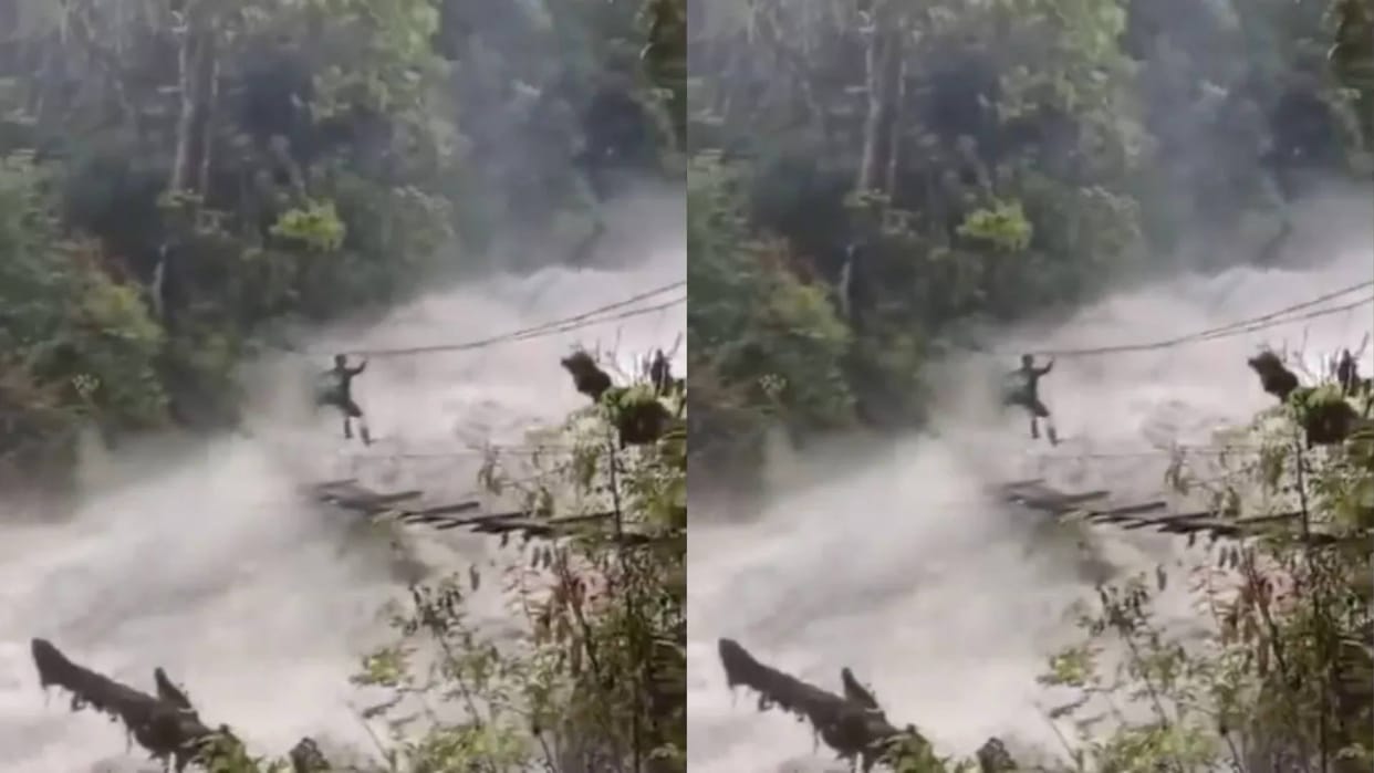 The river was in spate and the young man was crossing the makeshift bridge risking his life video goes viral