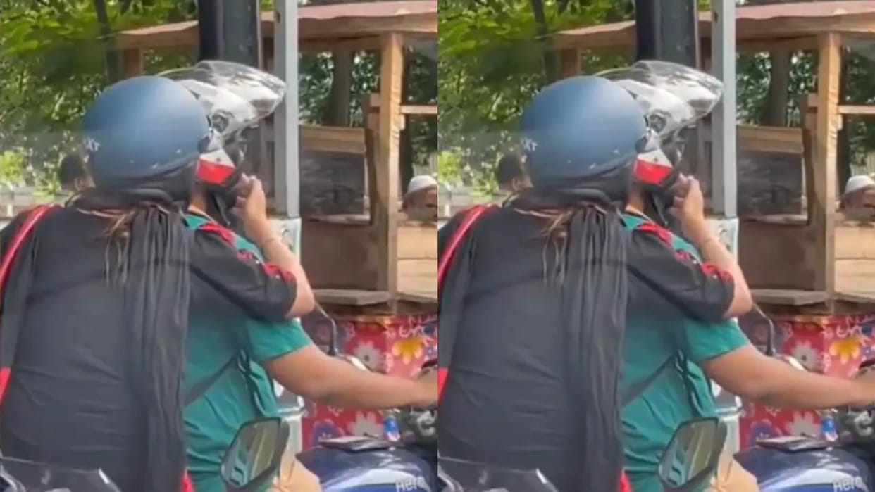 wife sitting behind on bike smoked cigarette herself and then made husband smoke it Video goes Viral