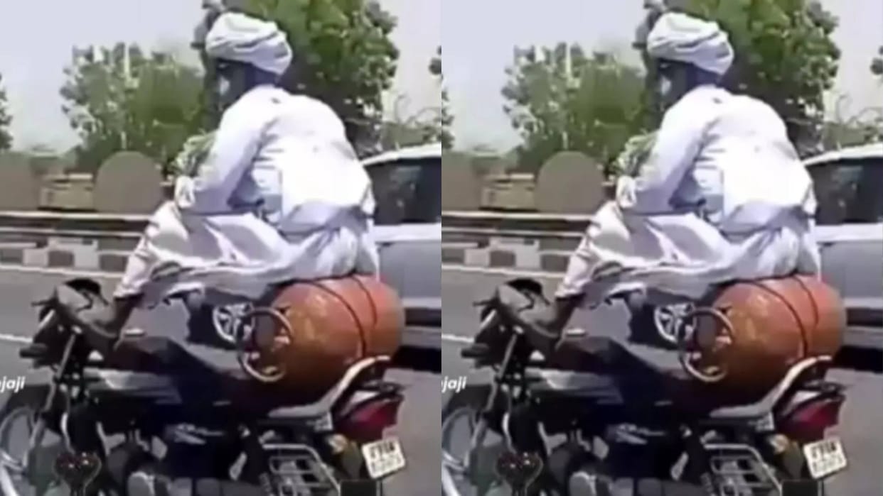 Old Man drove the bike with his feet in middle of the road was seen sitting stylishly on cylinder Video Viral