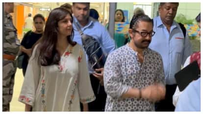 bollywood actor aamir khan spotted at delhi airport with girlfriend gauru spratt says eid mubarak
