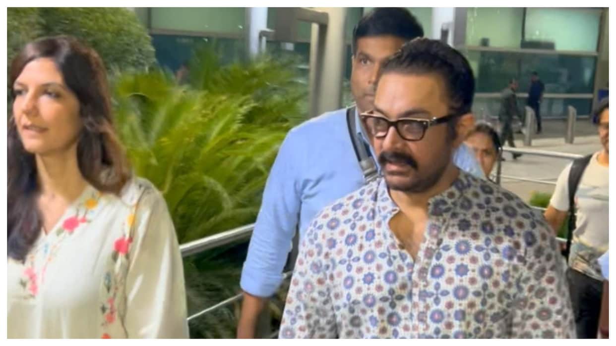 bollywood actor aamir khan spotted at delhi airport with girlfriend gauru spratt says eid mubarak