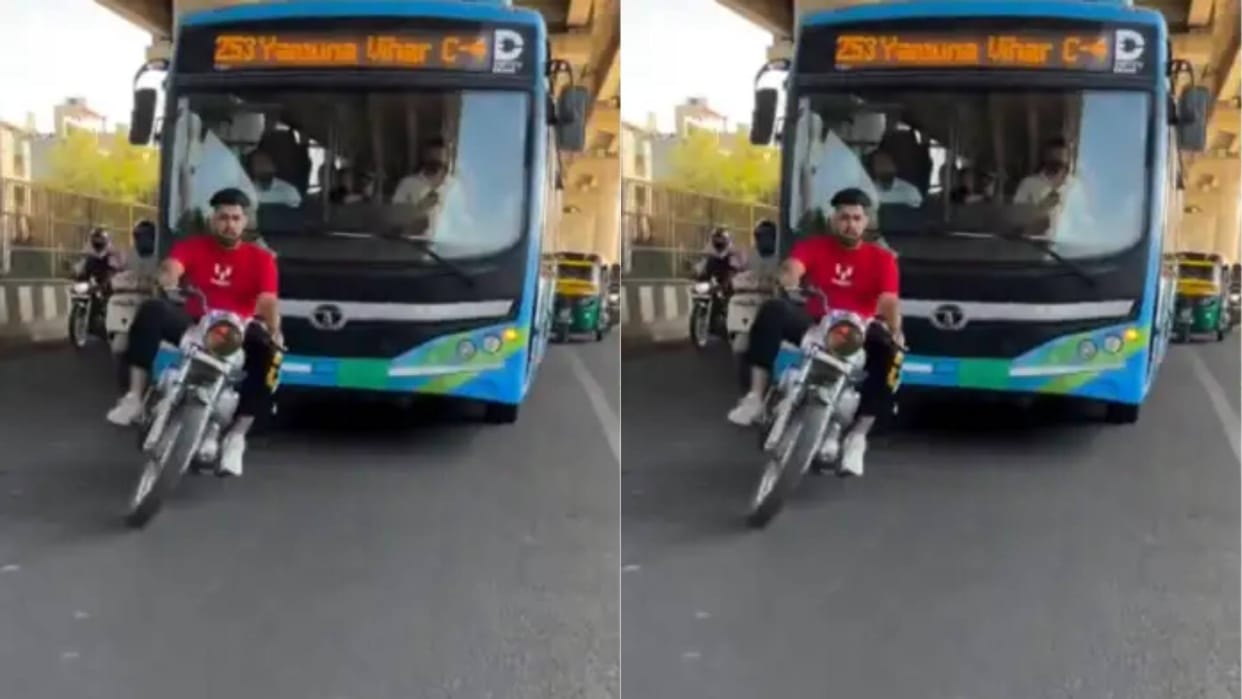 Boy was riding his bike like a snake in front of DTC bus Delhi Police caught him Video goes viral on Internet