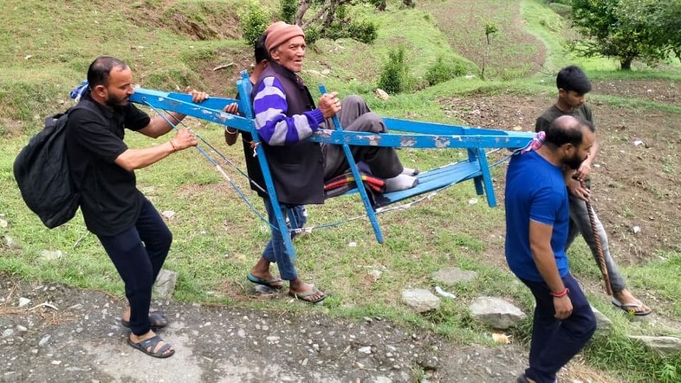 villagers carried the elderly patient on a doli from Anapaar to the road