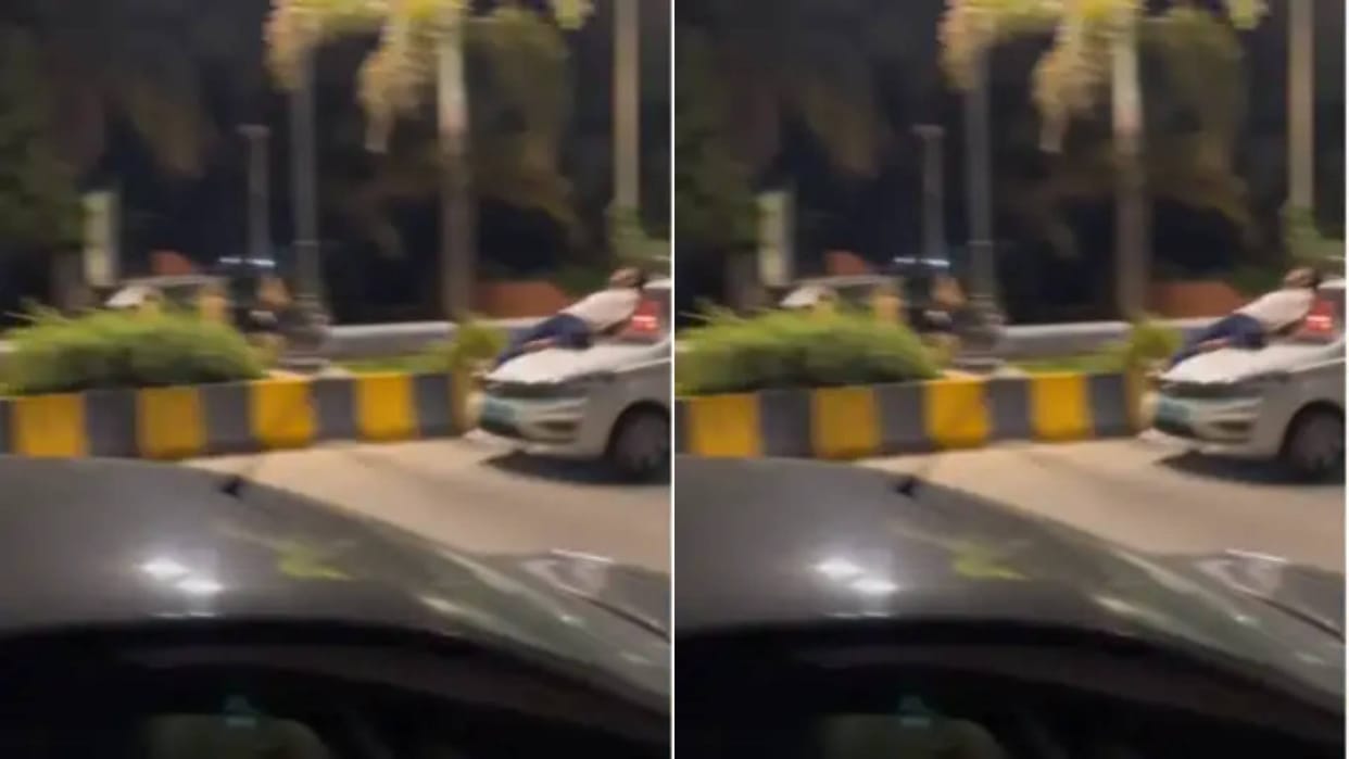 A man was becoming a hero by lying on the bonnet of a fast car Mumbai Police took action Video goes viral