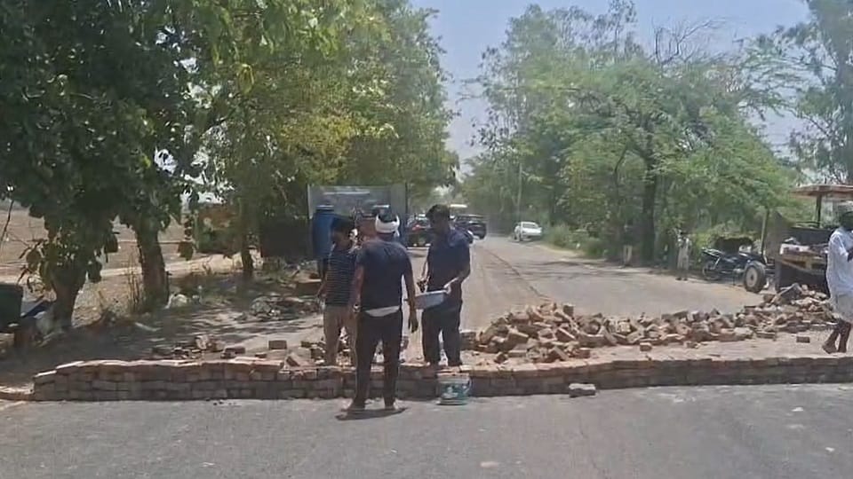 A wall was built in the middle of the road demanding compensation