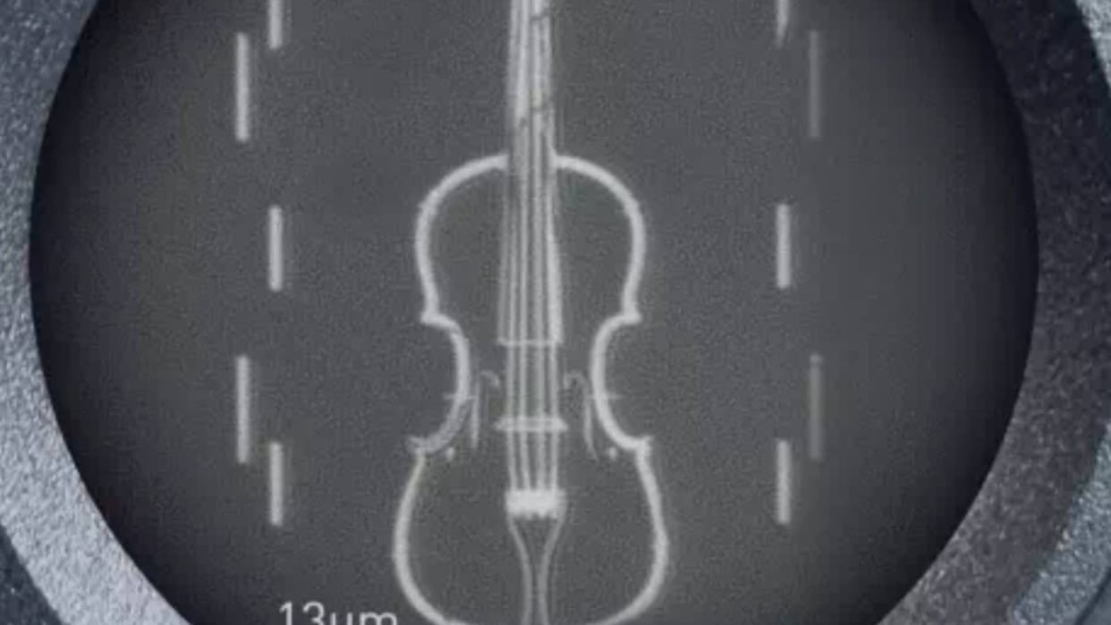 A violin thinner than a human hair has been made a microscope is required to see it Know other Details inside
