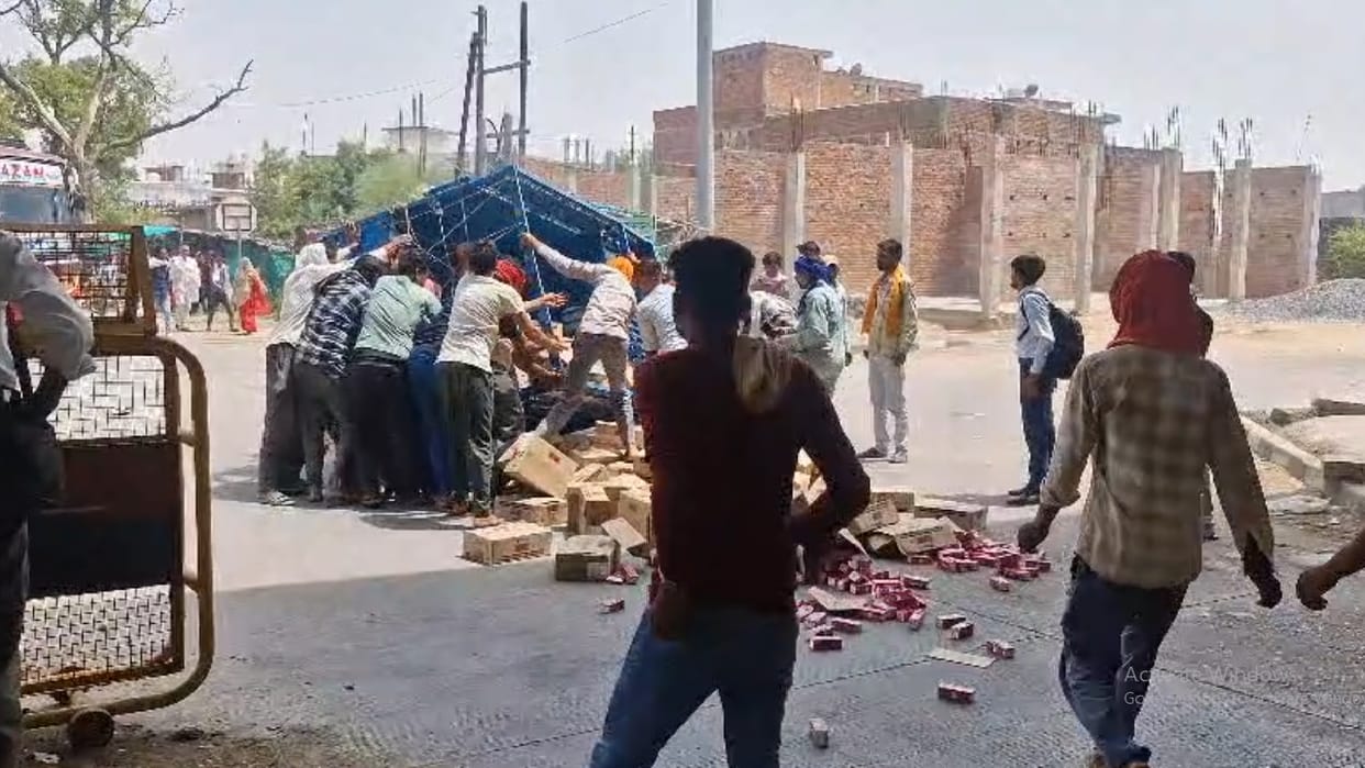 After accident in Jhansi people ran to pick up tetra packs of liquor scattered on the road