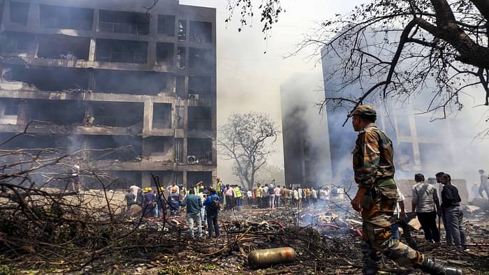 Ahmedabad Plane Crash Photos Air India Flight AI 171 debris Meghaninagar rescue operations NDRF Gujarat Police