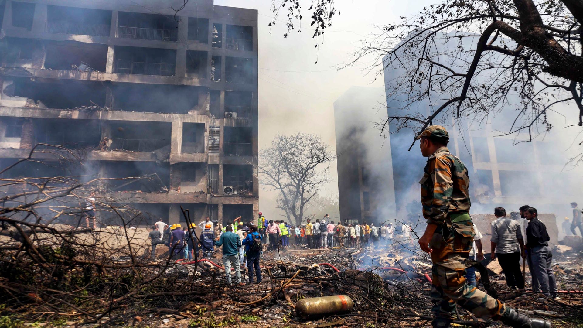 Ahmedabad Plane Crash Photos Air India Flight AI 171 debris Meghaninagar rescue operations NDRF Gujarat Police