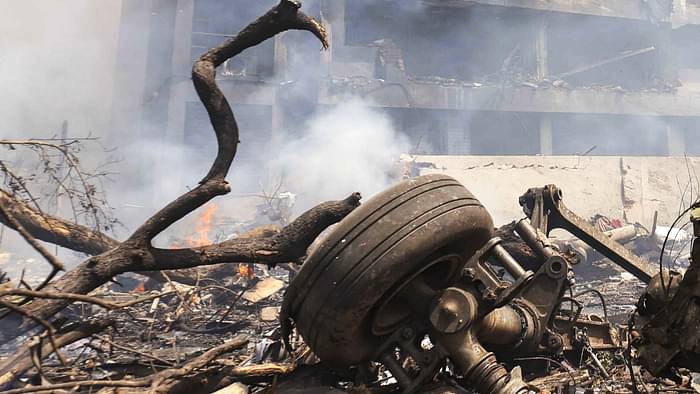 Ahmedabad Plane Crash Photos Air India Flight AI 171 debris Meghaninagar rescue operations NDRF Gujarat Police