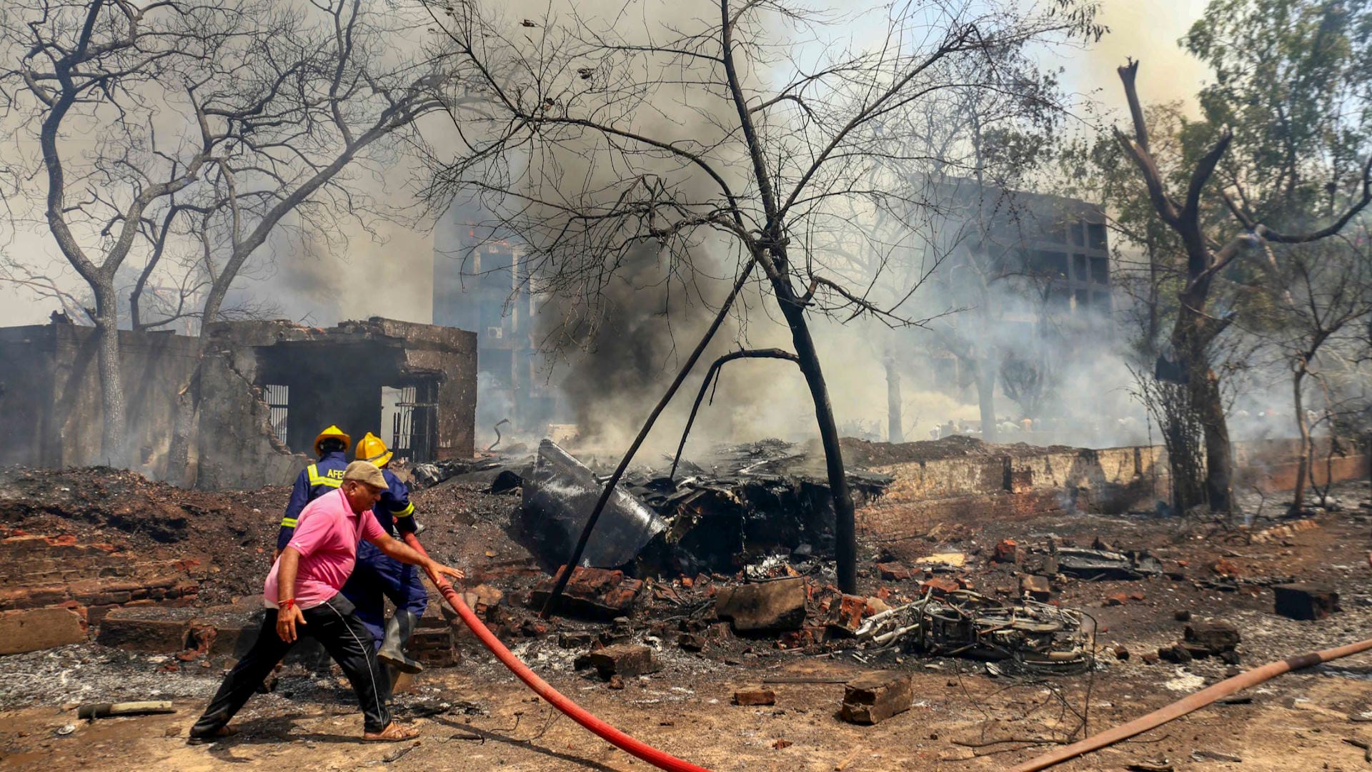 Ahmedabad Plane Crash Photos Air India Flight AI 171 debris Meghaninagar rescue operations NDRF Gujarat Police