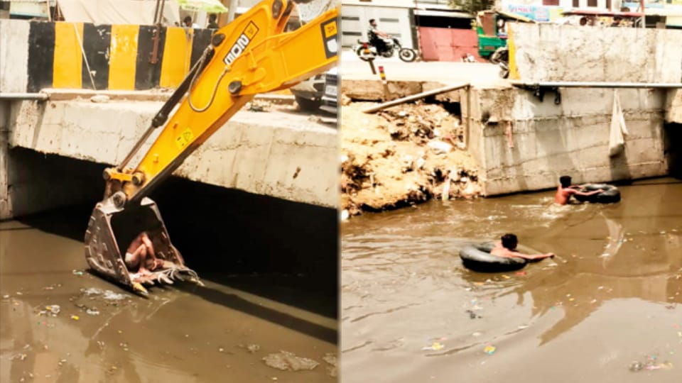 Sanitation workers lowered into drain via JCB in Meerut, manual cleaning done