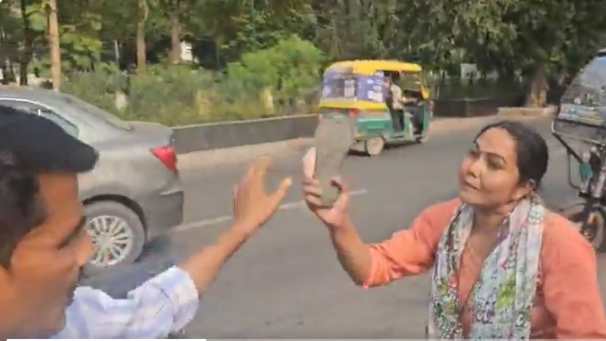Wife could not tolerate husbands infidelity beat him with slippers on the road Video goes Viral on Internet