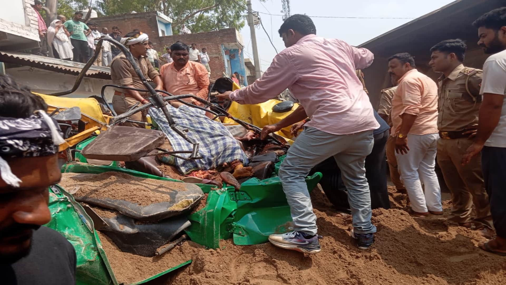 Sand laden dumper overturns on a tempo full of passengers, several people reported dead