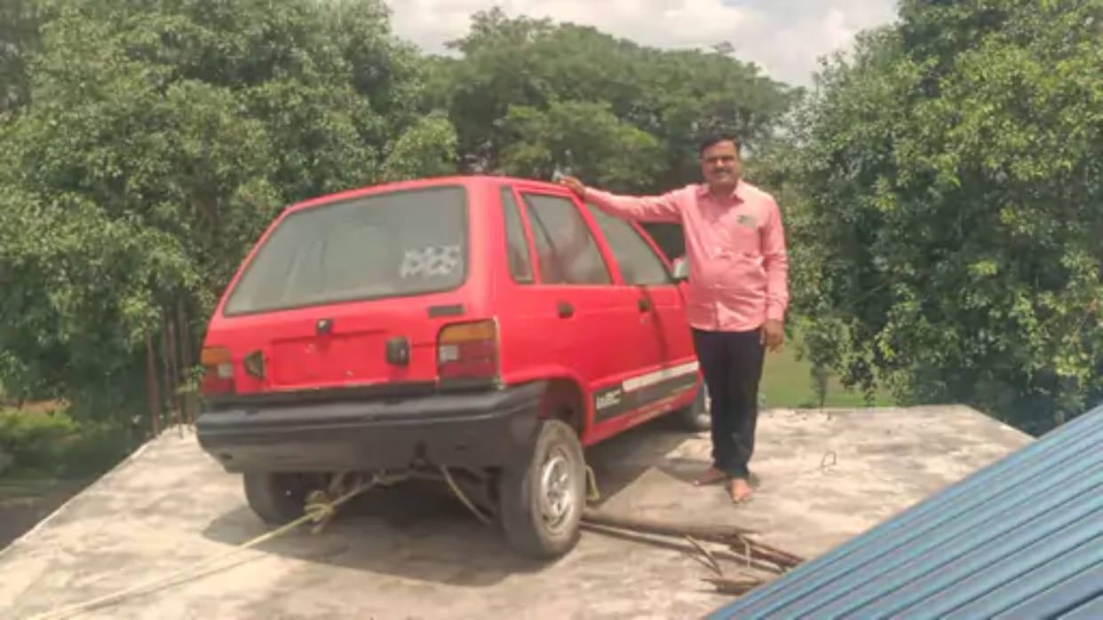 This man considers the car as God keeps it on the roof of the house and worships it Video goes Viral