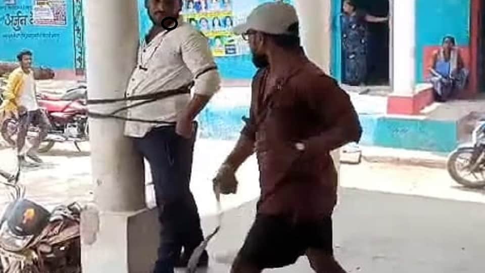 bullies tied the young man to a pole and beat him brutally