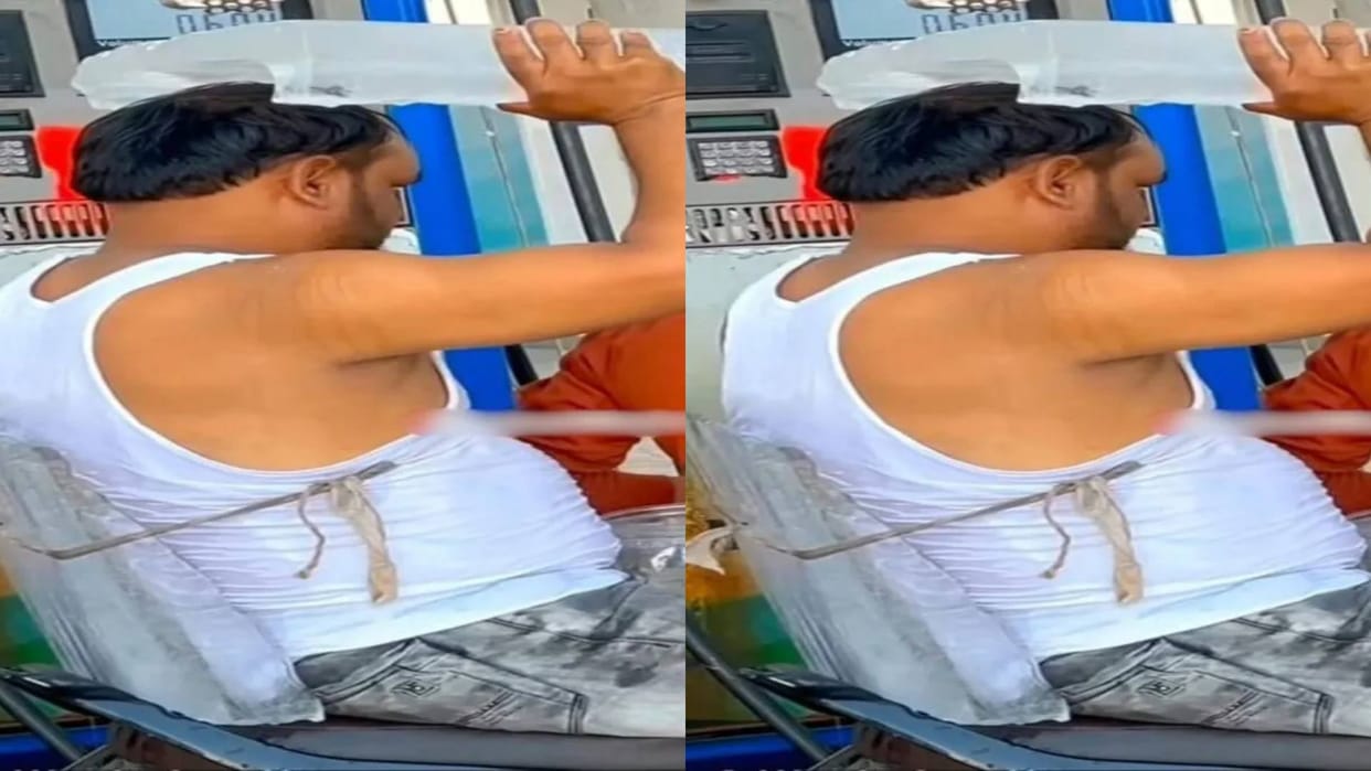 To get relief from the heat Man tied a block of ice on his head and back Video goes Viral on Internet