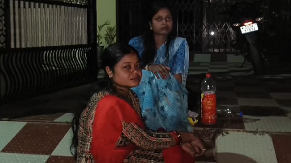 Two daughters-in-law sit on a dharna outside their sasural in Balod