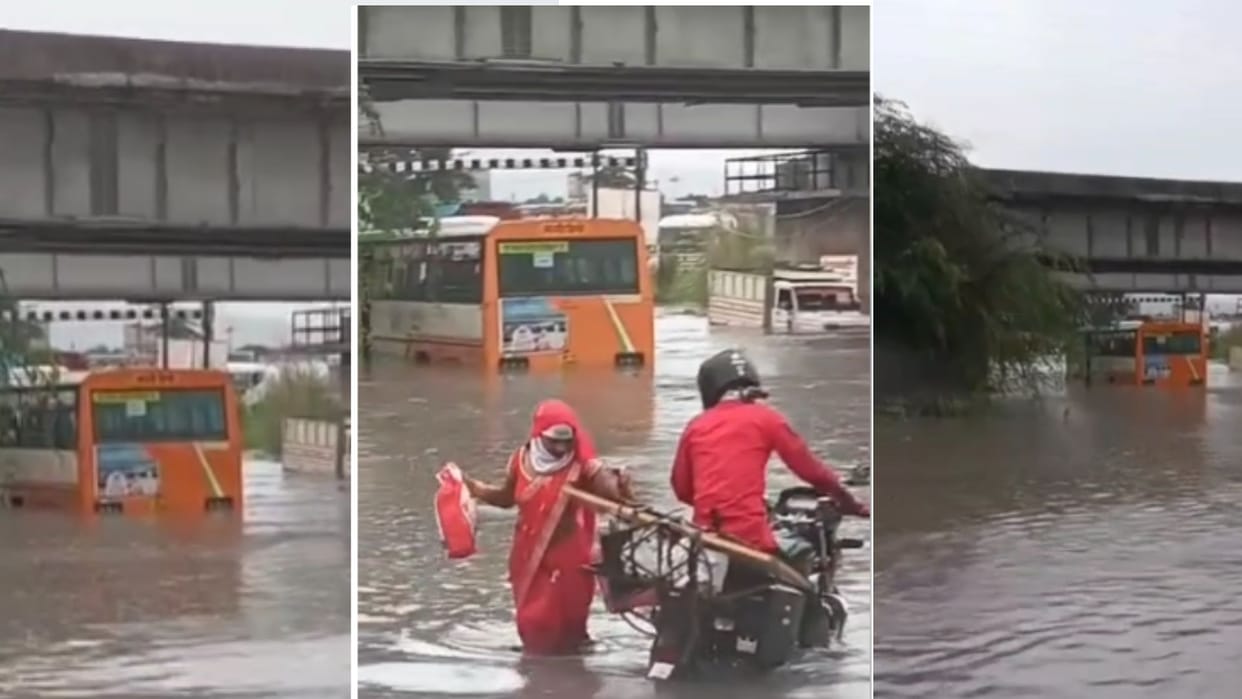 Roadways bus and pickup full of passengers stuck in railway underpass amid rain in Sonbhadra