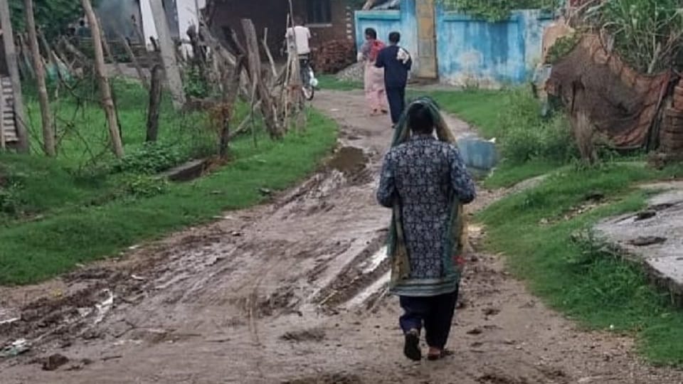 people of Pachpakariya colony take their children to school in their arms In the rainy season at banbasa