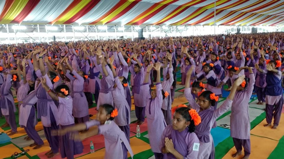 More than 25 thousand tribal students created a world record of Surya Namaskar in Visakhapatnam