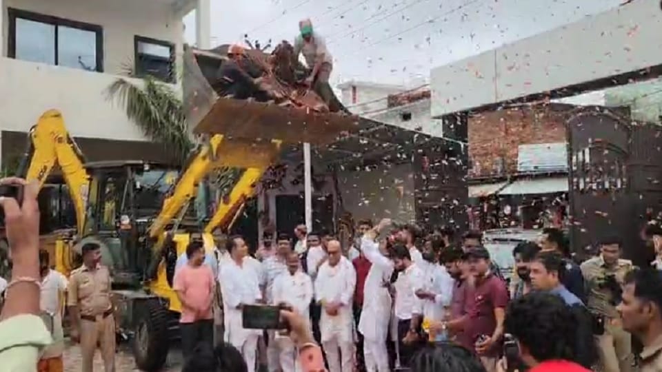 Congress state president Ajay Rai was welcomed with flowers showered from a bulldozer in Jhansi