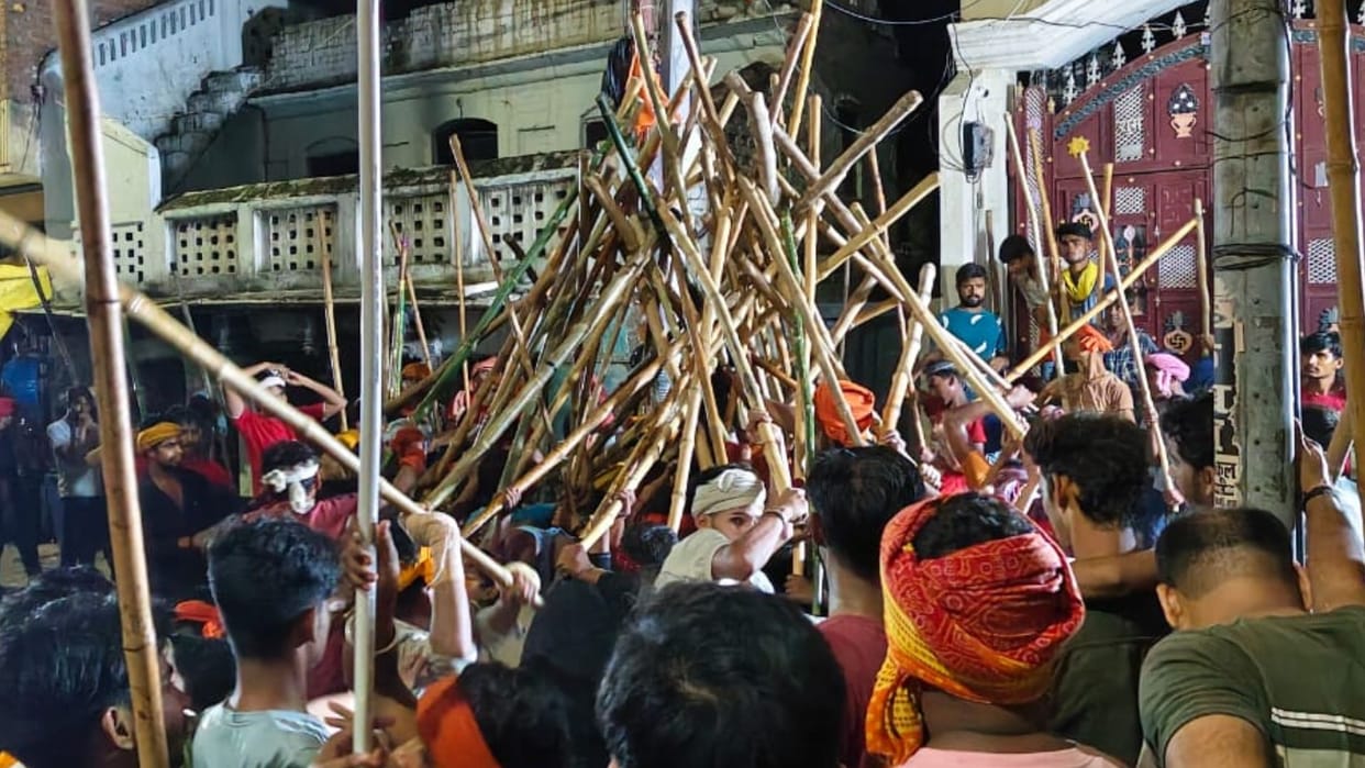 Bharat Akhara procession in ballia Devotion and bravery were on display devotees swung sticks
