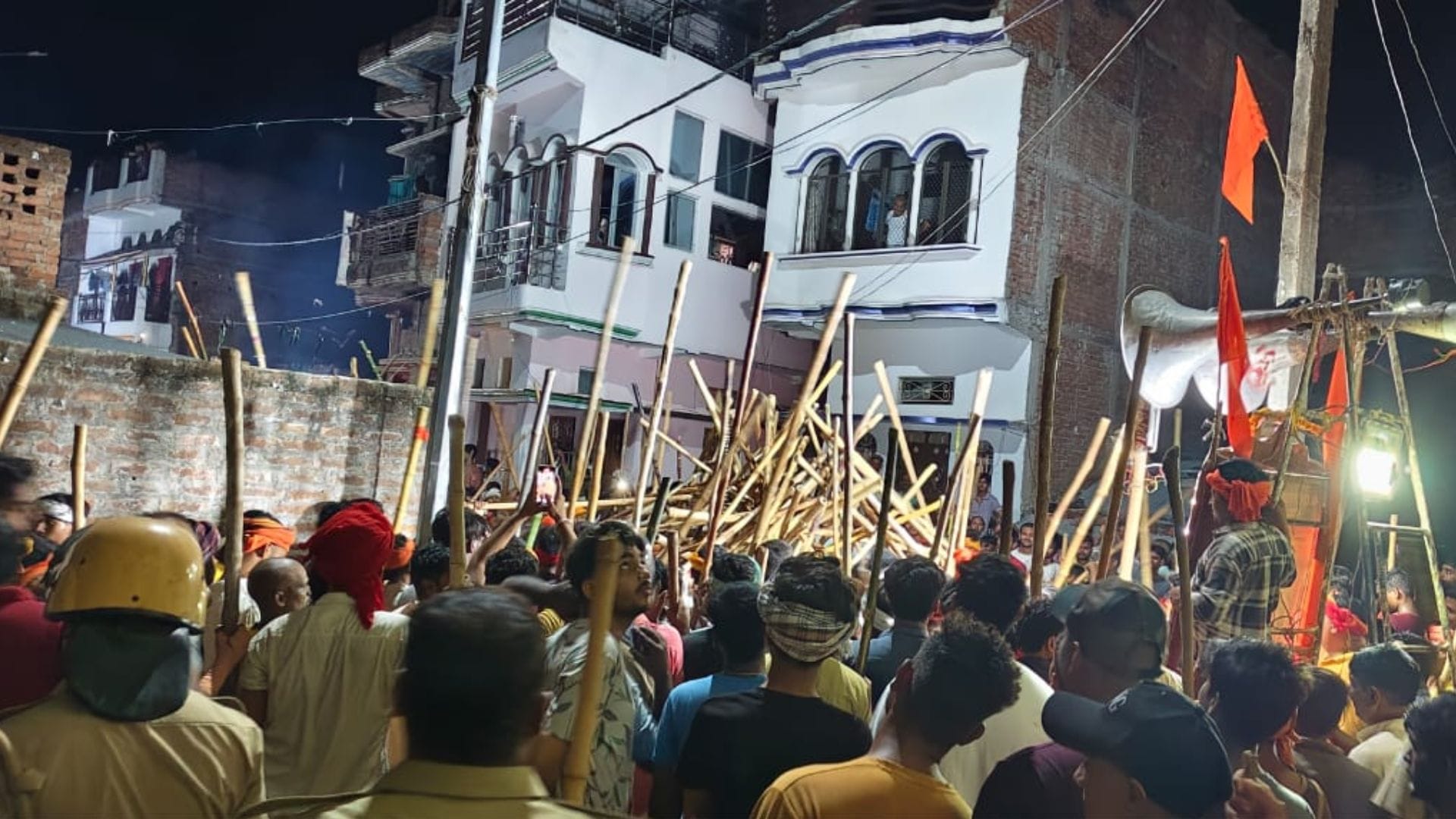 Bharat Akhara procession in ballia Devotion and bravery were on display devotees swung sticks