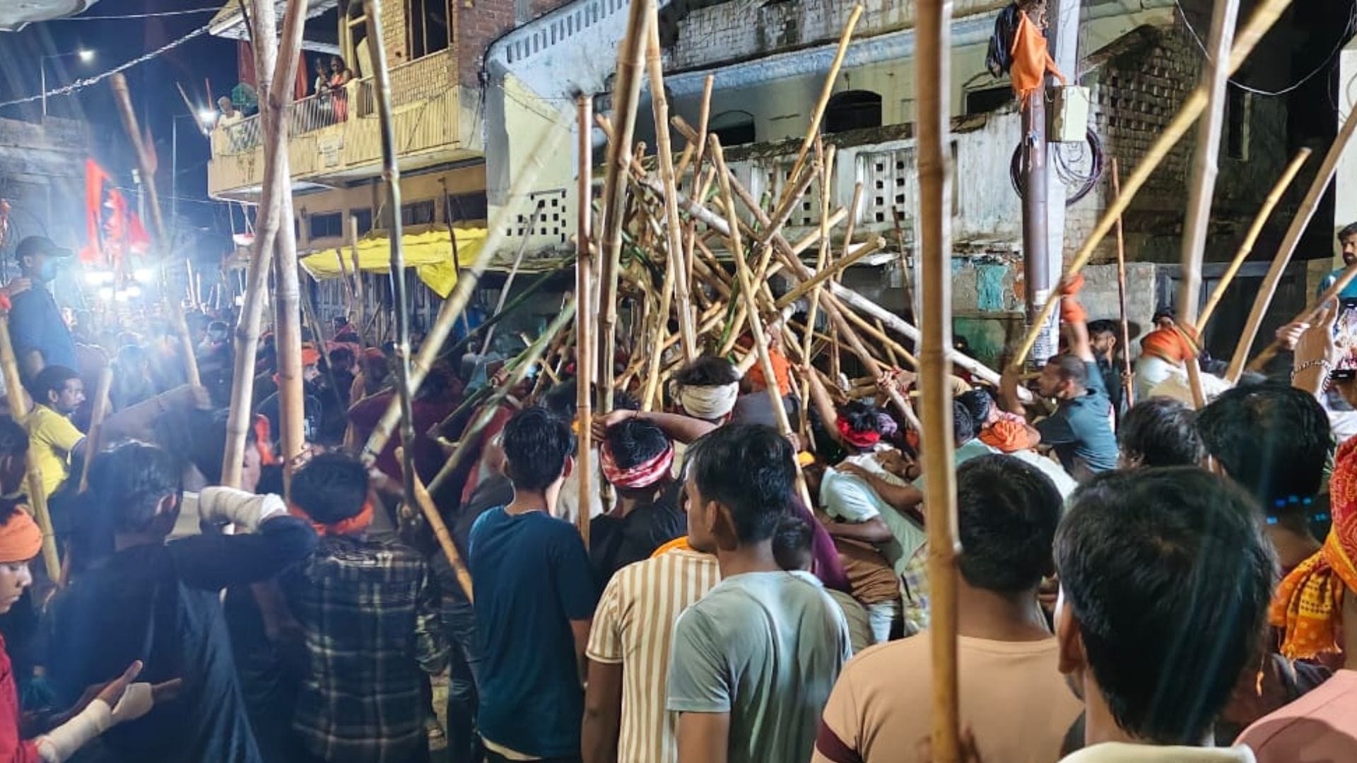 Bharat Akhara procession in ballia Devotion and bravery were on display devotees swung sticks
