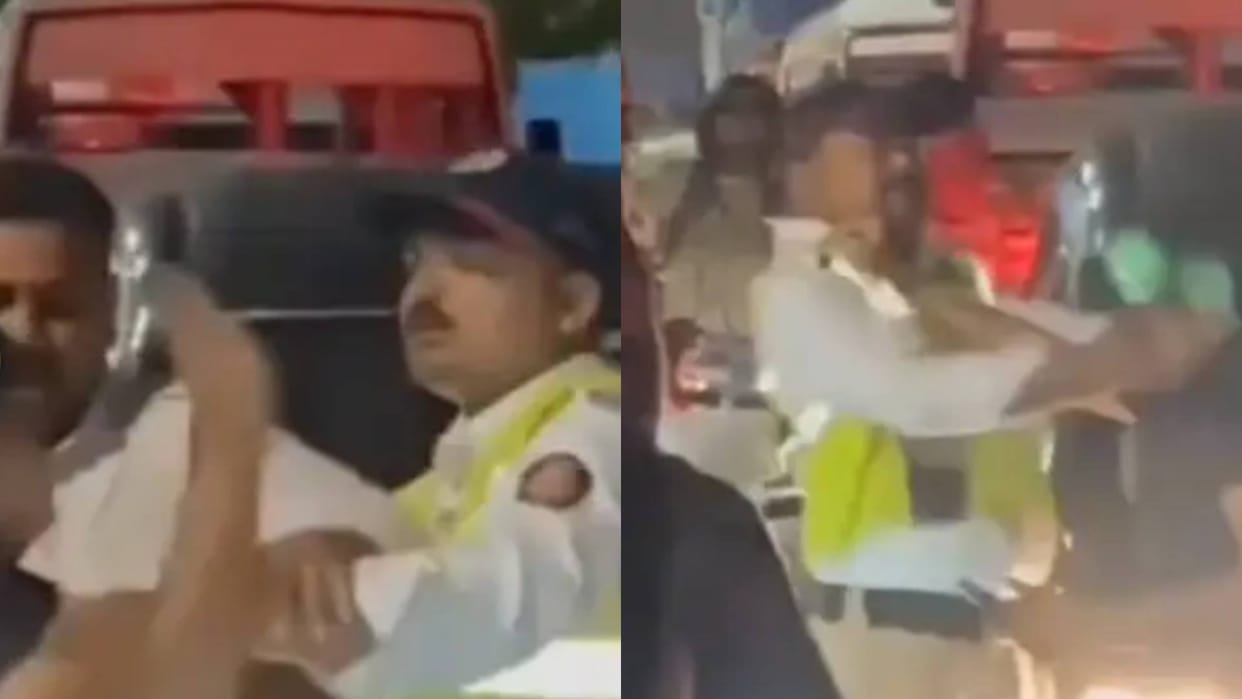 Traffic police grabbed the collar of a boy and slapped him then the man slapped him back Video goes Viral