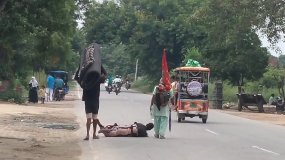 man is going to Mehandipur Balaji by lying down to get a son