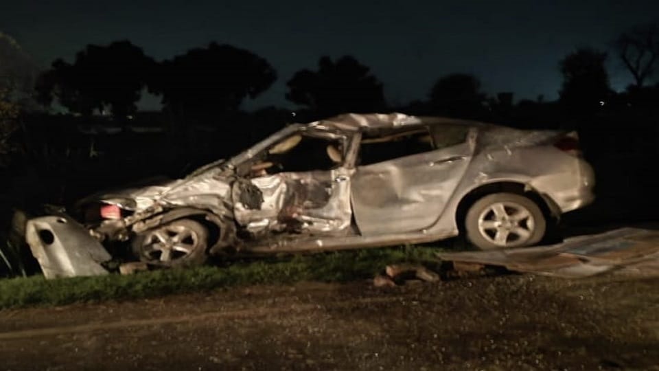 A young man died and three were injured in a collision between a car and a loader tempo