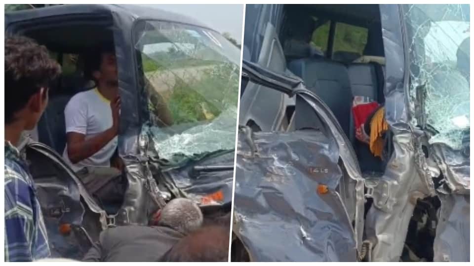 Driver trapped in pickup vehicle after collision with truck