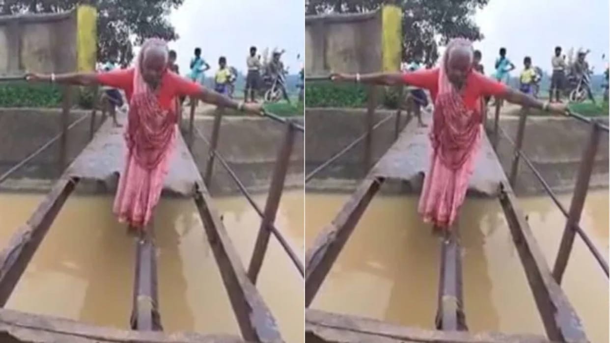 An old grandmother risked her life to cross a broken bridge over a river DM ordered for its repair Video Viral