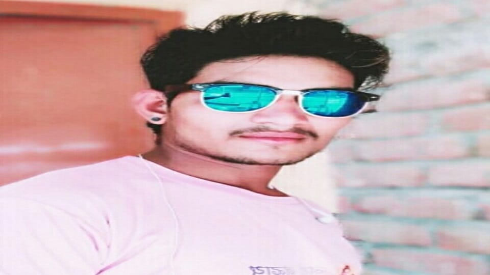 young man committed suicide by hanging himself from fan