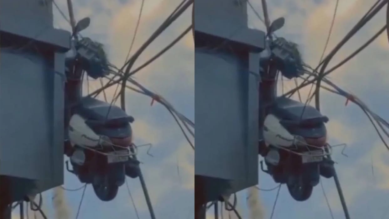 Scooty hanging on top of the building, people were surprised to see it said it must be the work of some girl