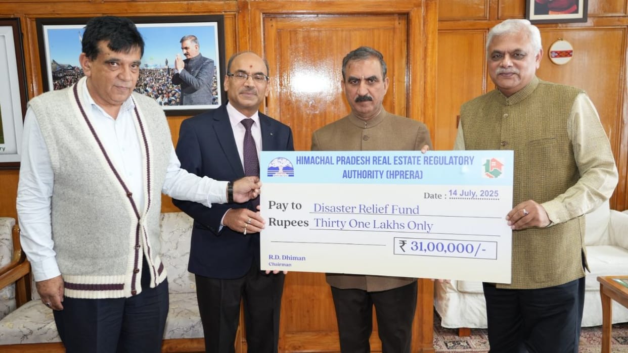 Himachal RERA Chairman presented a cheque of Rs 31 lakh to the Chief Minister Relief Fund