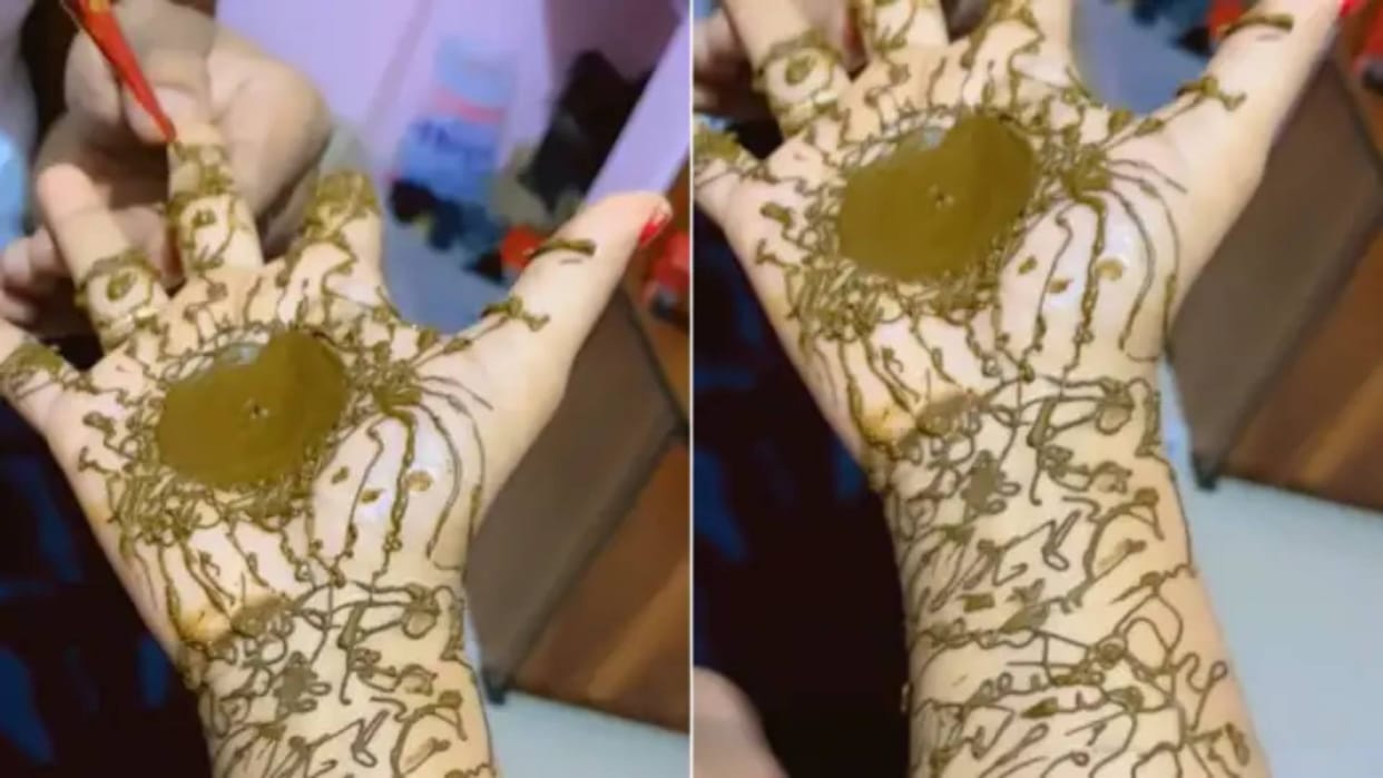 Husband sat down to apply mehendi to his wife cooked khichadi in the name of design Video goes Viral