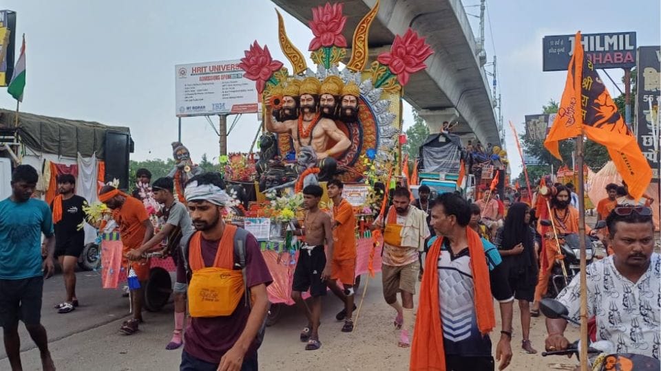 Kanwariyas are going towards their destination with attractive tableaus of gods and goddesses