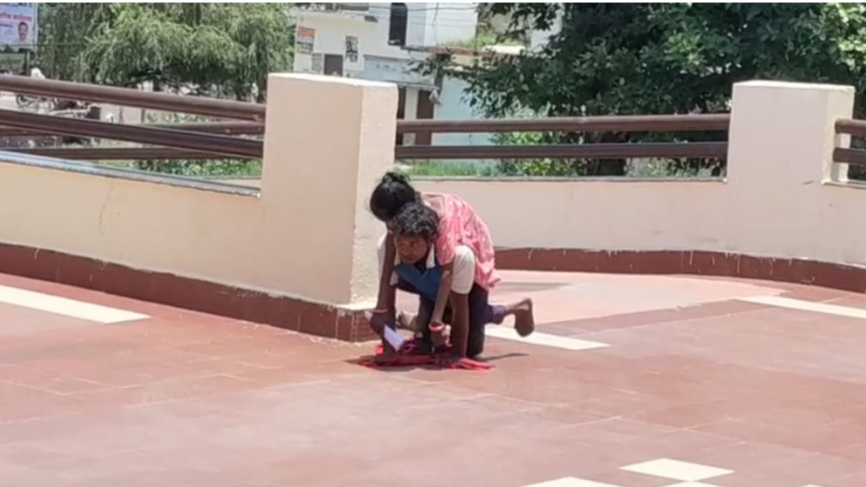 handicapped person reached DM office carrying his wife on his back in azamgarh