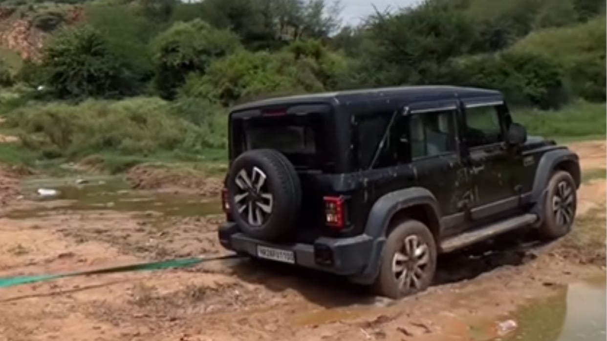 Tata harrier ev pulls mahindra thar roxx out of mud viral video