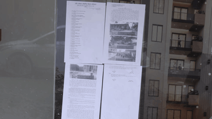 Notices pasted on buildings built on the land of Maharishi Ashram